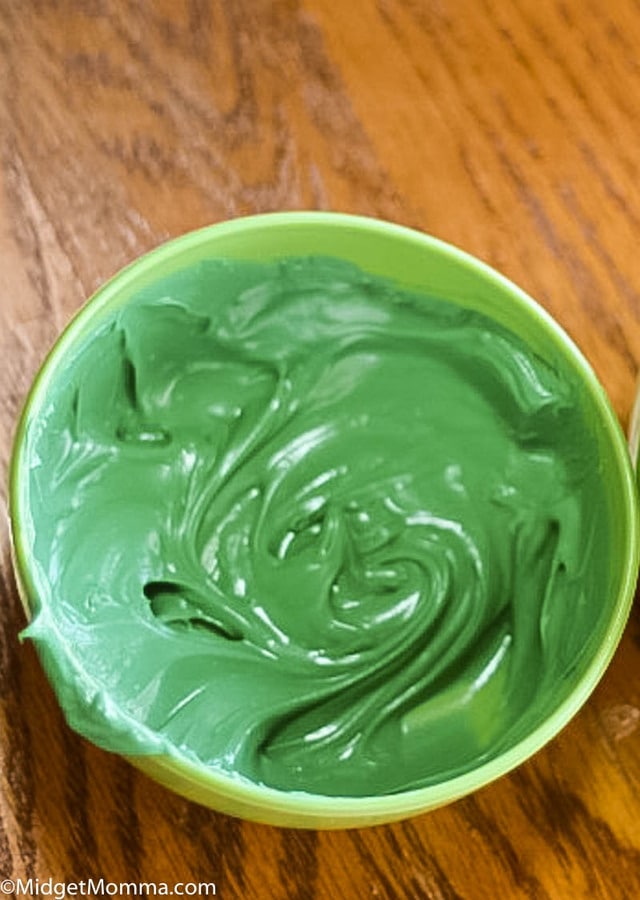 melted green chocolate for St. Patrick's Day Chocolate Covered Pretzel Sticks