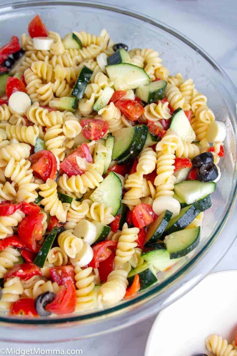 Easy Italian Pasta Salad in a bowl with rotini noodles, cucumbers, olives, tomatoes and italian dressing