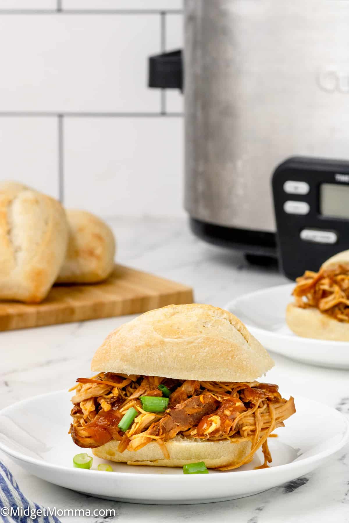 Slow Cooker Honey Garlic Chicken sandwich on a plate