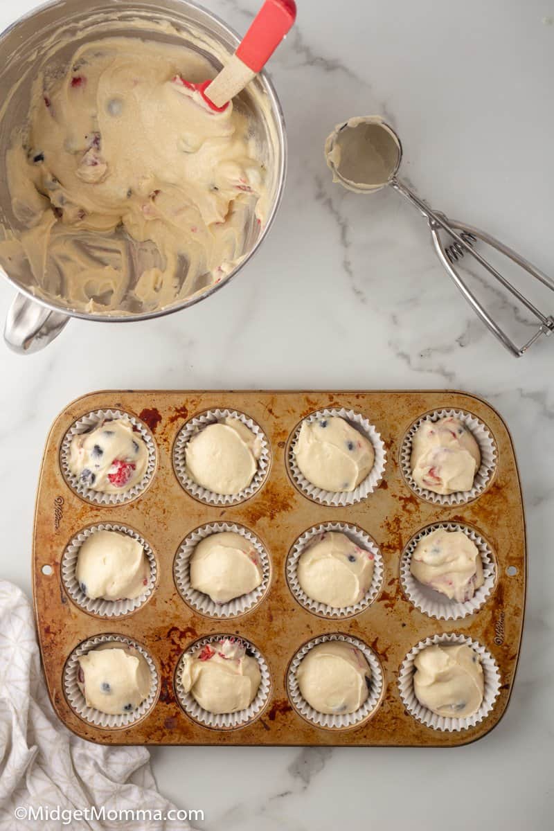 muffin mixture in muffin tin ready to be baked