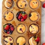 overheaad shot of Triple Berry Muffins in a muffin tin