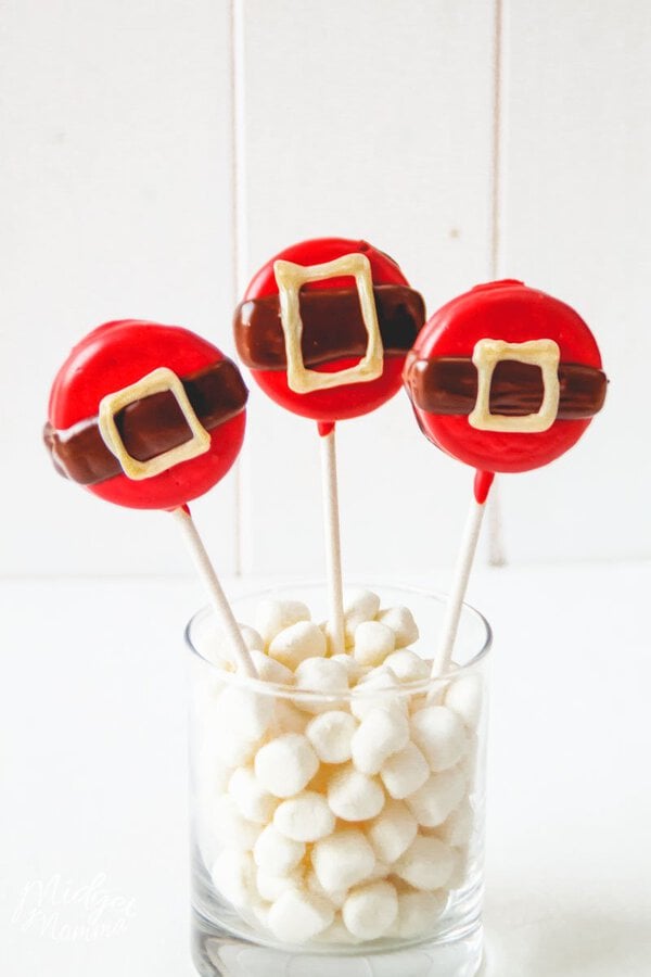 Christmas Oreo Pops decorated to look like Santa's belly