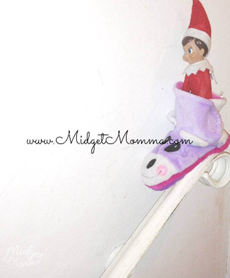 Easy Elf on the Shelf Ideas- elf in a slipper sliding down a banister