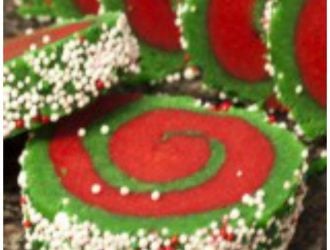 These Whoville cookies are a great take on a yummy sugar cookie. They are just two different colored sugar dough rolled up with fun sprinkles. Christmas sugar cookie, red christmas cookie, green christmas cookie, fun christmas cookie, sugar cookies, rolled cookies, holiday cookies, red and green christmas cookies.