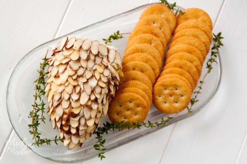 pinecone cheese ball on a tray with crackers 