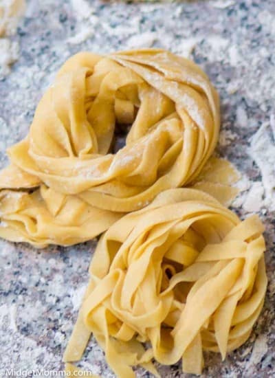Homemade pasta piles on a cutting board