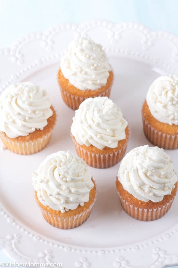 vanilla cupcakes on a white platter