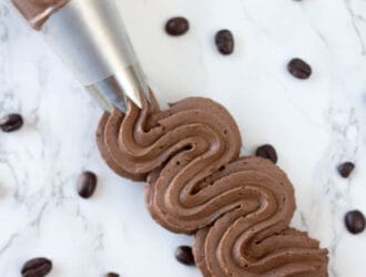 MOcha buttercream frosting in a piping bag