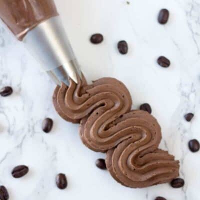 MOcha buttercream frosting in a piping bag