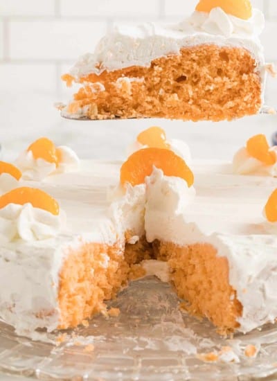 front photo of Orange Soda Cake with a slice cut out