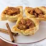 3 puff pastry apple pie on a dessert plate