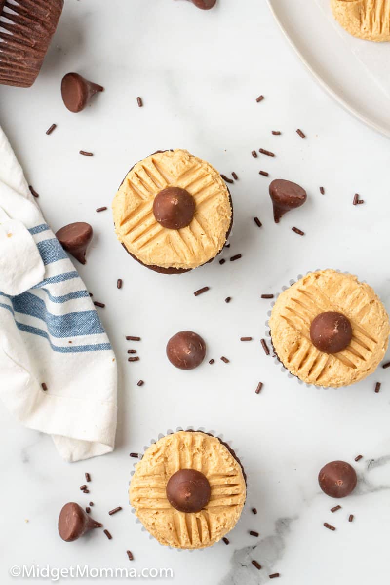 overhead photo of 3 Peanut Butter Blossom Cupcakes