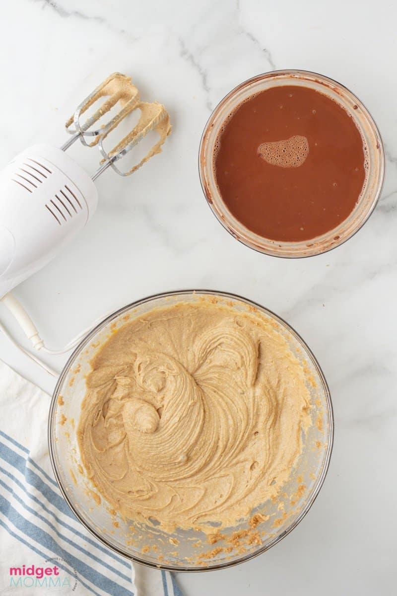 brown sugar, granulated white sugar and butter in a clear glass bowl mixed together