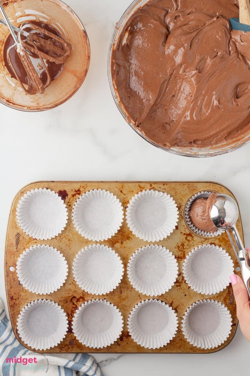 cupcake batter being put into cupcake tin