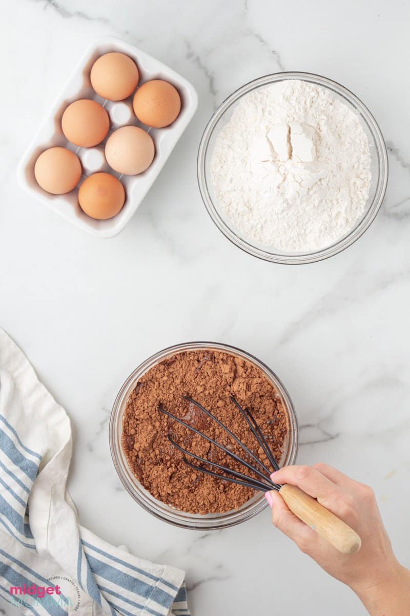 cocoa powder being mixed with hot coffee