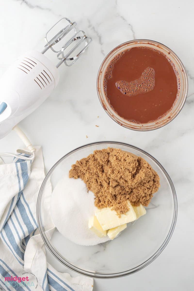 brown sugar, granulated white sugar and butter in a clear glass bowl