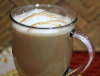 Caramel Macchiato Starbucks copycat recipe in a cup on the kitchen counter