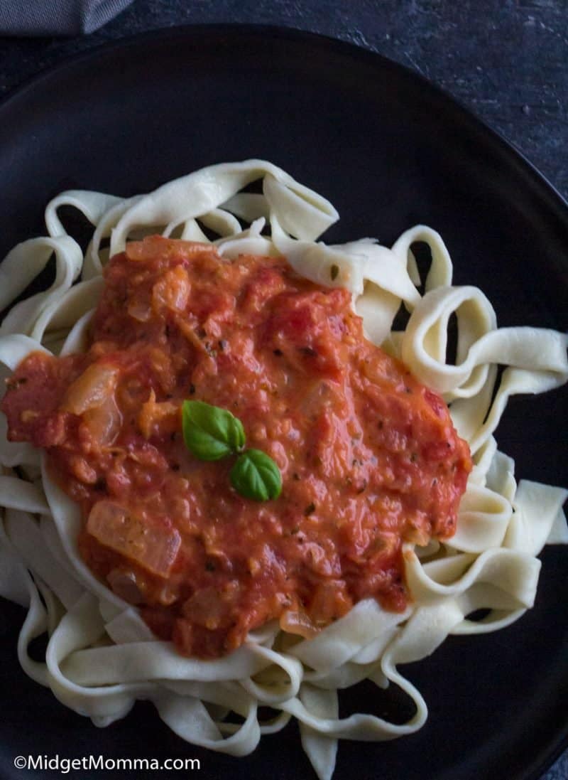 close up photo of pasta on a plate topped with easy Creamy tomato sauce