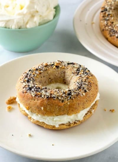 Keto bagel with cream cheese on a plate