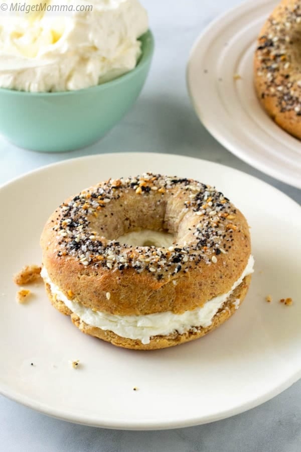 Keto bagel with cream cheese on a plate