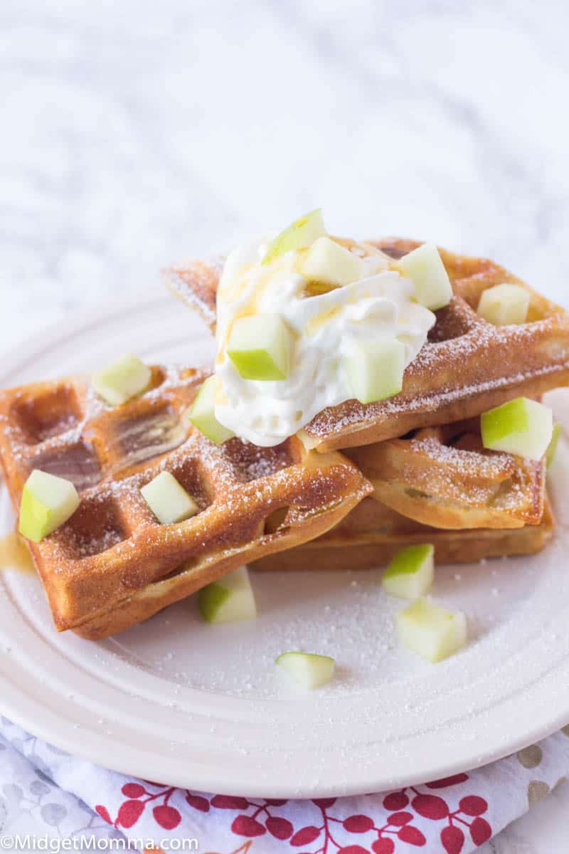 apple cinnamon waffles with diced apples and whipped cream