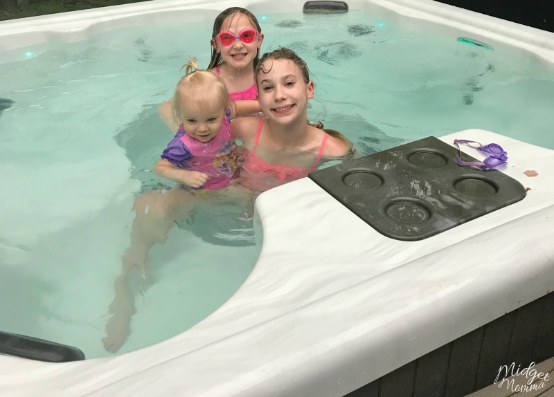3 girls enjoying the summer in the hot tub.