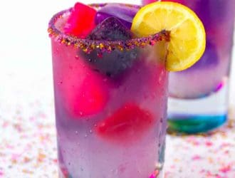 Unicorn lemonade is a fun and tasty color changing drink. Magical just like unicorns but super tasty this unicorn drink will be a hit for everyone. If you are a fan of the Unicorn Lemonade Starbucks drink then you are going to love making this fruity unicorn lemonade drink at home. This easy lemonade recipe is made with homemade lemonade! #Unicorn #Lemonade #HomemadeLemonade #unicorndrink #unicornfood #LemonadeRecipe