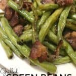 Made in a foil packet, Green Beans with Bacon is made with fresh green beans and filled with buttery garlic bacon flavors and cooked right on the grill! #GreenBeans #Grilled #Garlic #Bacon #FoilPacket #grillRecipe #GreenBeanswithBacon