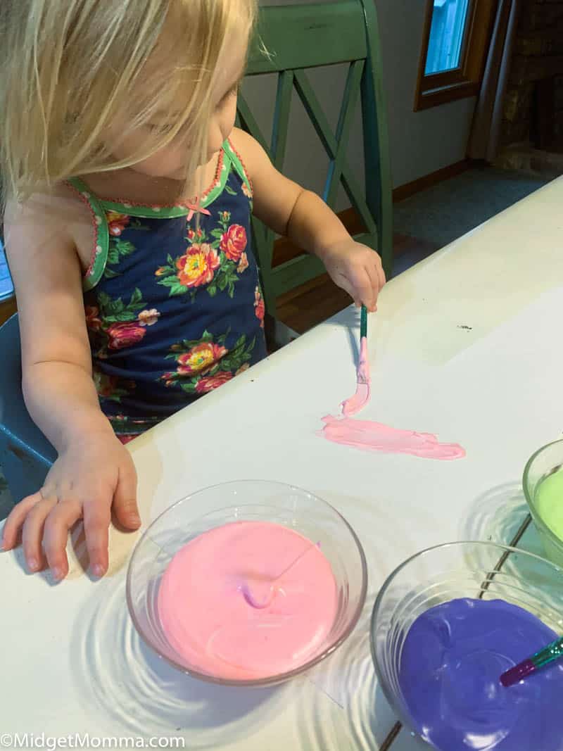 Toddler painting with homemade puffy paint