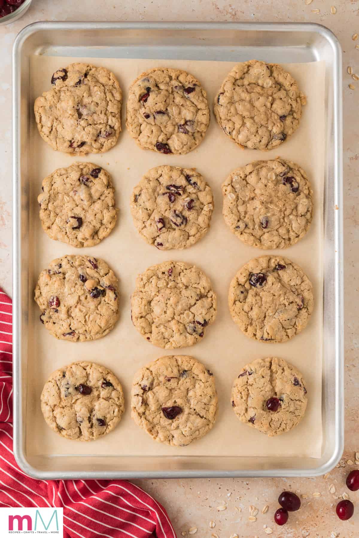 baked cranberry oatmeal cookies on a baking sheet