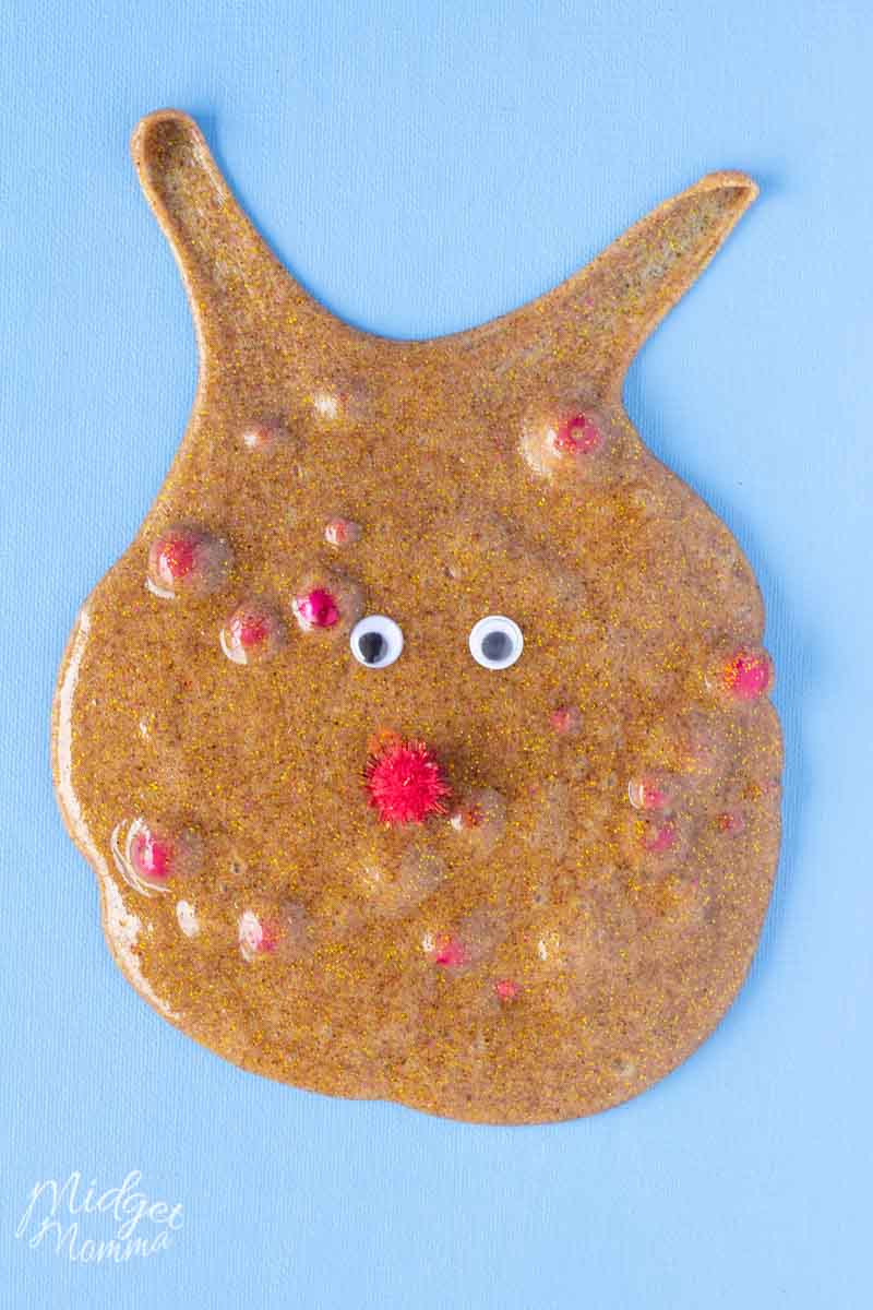 This Cinnamon Scented Reindeer Slime is so much fun to make! A clear glue slime recipe that uses cinnamon to color the slime and make it smell amazing. Add in some fun red beads and red puffs and googley eyes to make this fun christmas slime look like rudolf the red nose reindeer!
