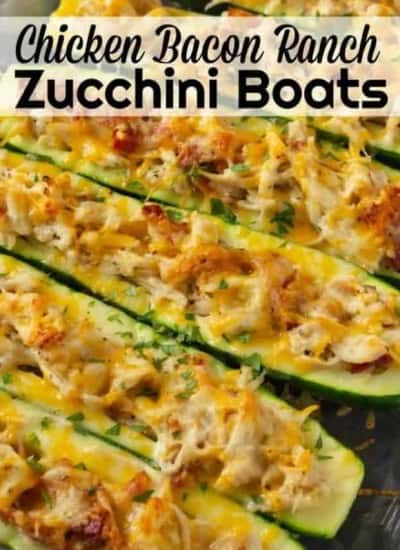 Chicken Bacon Ranch Zucchini boats are an amazing stuffed zucchini boat recipe. Easy to make baked zucchini recipe that has amazing flavors of chicken, bacon and ranch and then topped with cheese! #chicken #Bacon #Ranch #Cheese #zucchini #keto #lowCarb #BakedZucchini #Easy Recipe #ZucchiniBoats