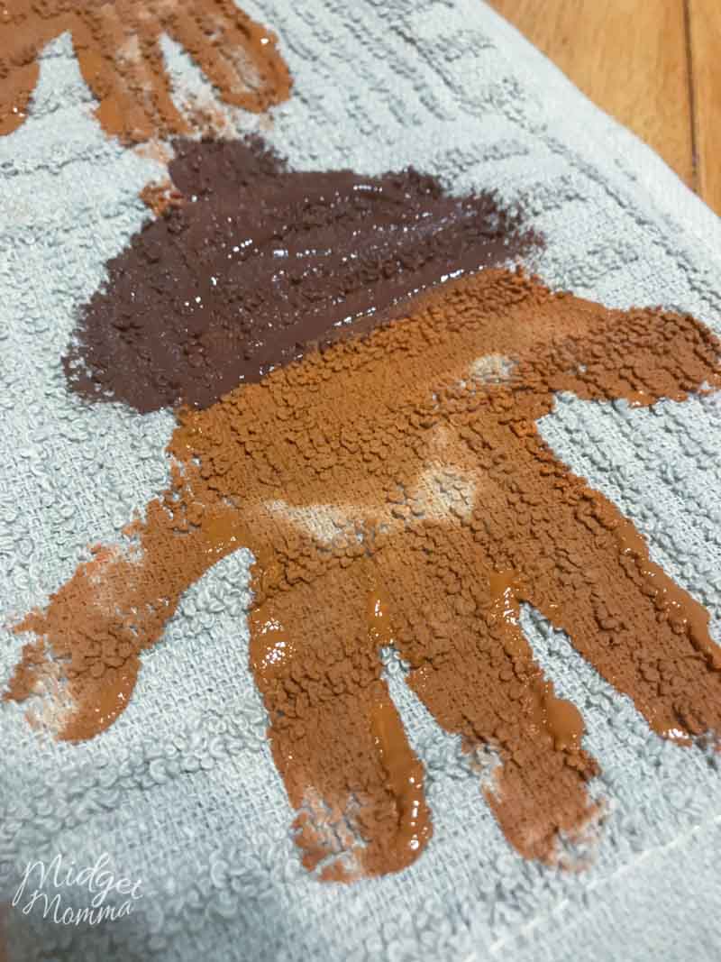kids handprint acorn on a kitchen towel