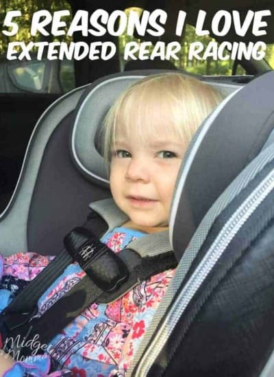 smiling and Happy child sitting rear facing in their car seat