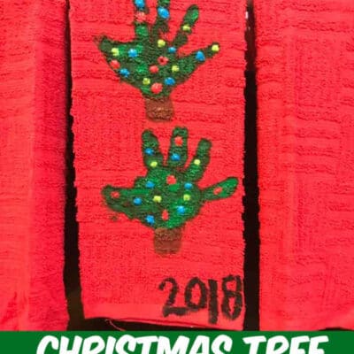 handprint Christmas Tree towel hanging on the stove door in the kitchen