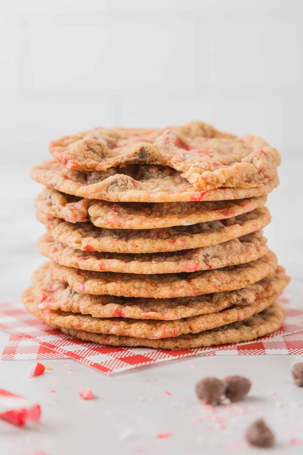 A stack of peppermint chocolate chip cookies on a table.