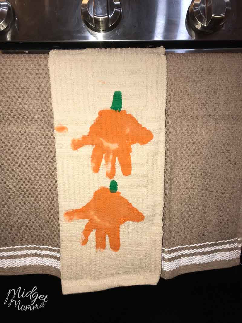 pumpkin handprint towel hanging on the stove