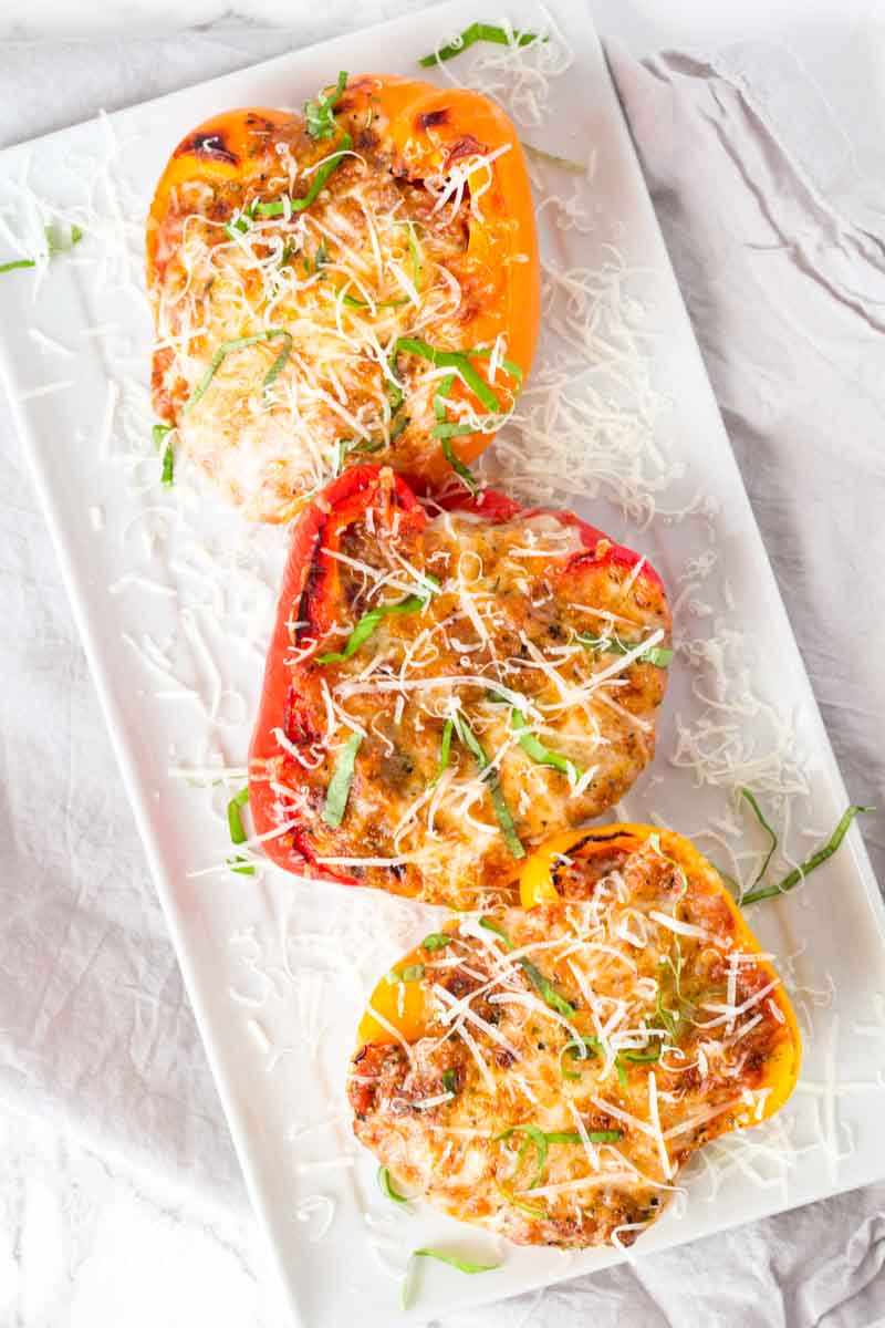 Lasagna Stuffed peppers using red and yellow bell peppers stuffed with cheesy ground beef