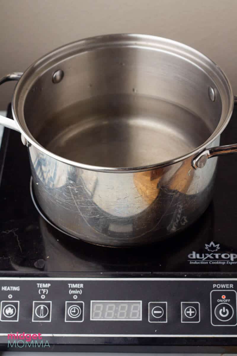 water in a metal pot on the stove