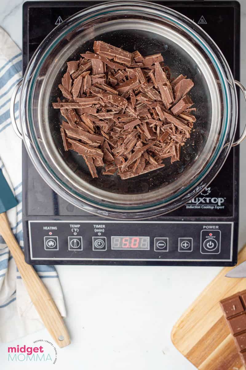 chocolate in a glass bow on top of a double boiler