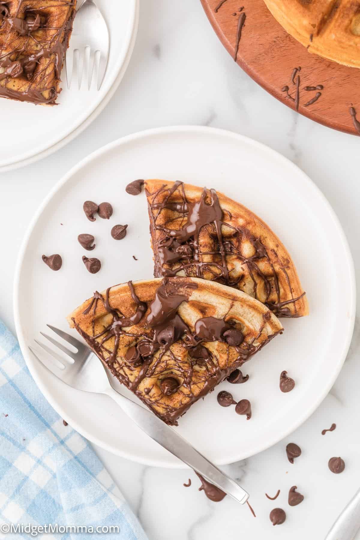 overhead photo of Chocolate Chip waffles on a plate with melted chocolate 