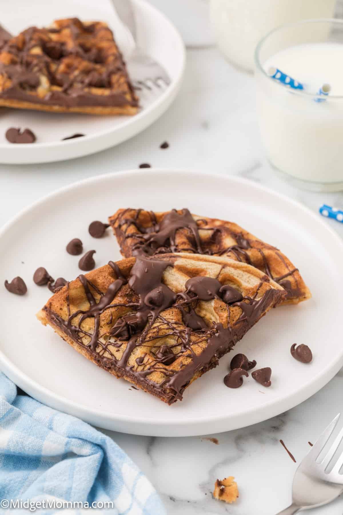 close up photo of Chocolate Chip waffles on a plate topped with chocolate chips