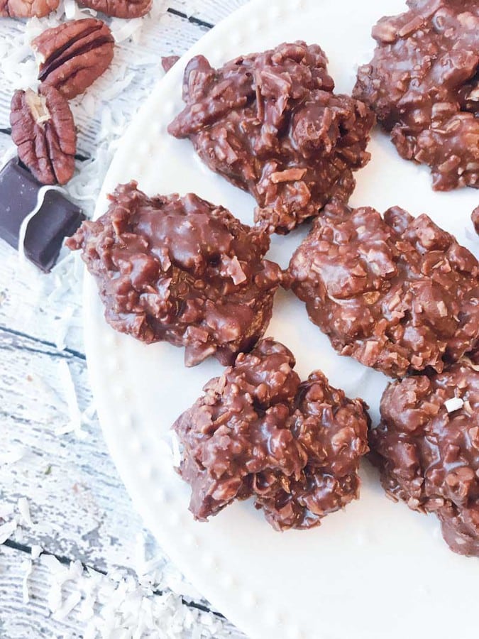 Low Carb Chocolate Peanut butter Coconut Pecan Cookies on a white plate to be served.