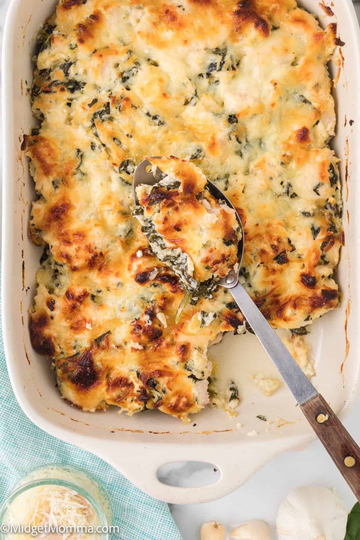 Spinach Artichoke Chicken Casserole recipe with a serving spoon