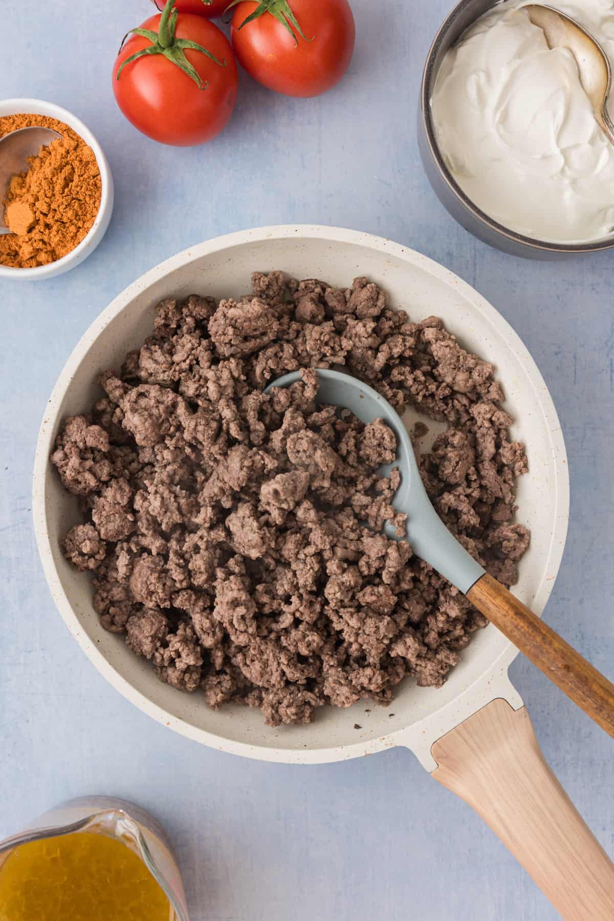 Ground beef in a frying pan.