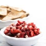 strawberry dessert salsa in a bowl with cinnamon sugar tortilla chips