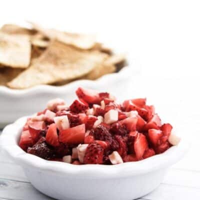 strawberry dessert salsa in a bowl with cinnamon sugar tortilla chips