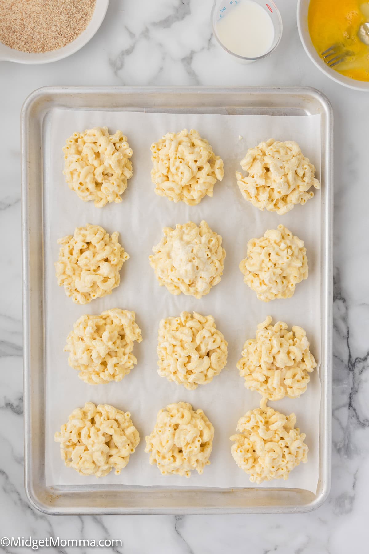 balls of macaroni and cheese on a baking sheet