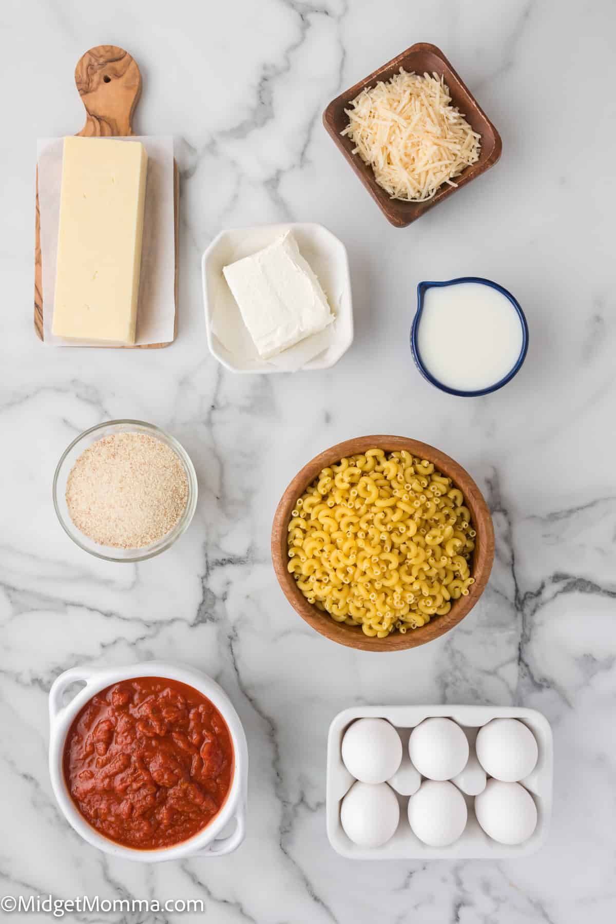 Fried Mac and Cheese Balls Recipe ingredients on a white background including pasta, cheese, cream cheese, milk and pasta sauce.