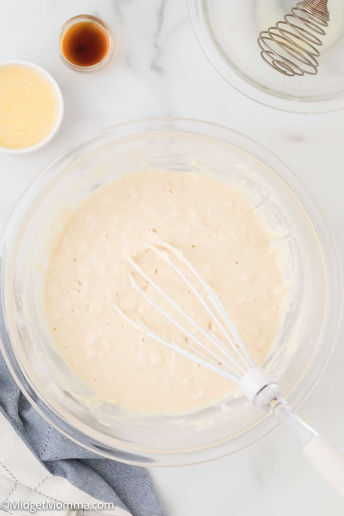 wet and dry ingredients for The Best Fluffy Homemade Pancakes Recipe being mixed together in a bowl